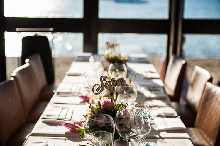 Reception Table Settings Wooden Sign Floral Centrepiece Water View St Tropez Destination Wedding http://www.gemmamcauleyphotography.com/