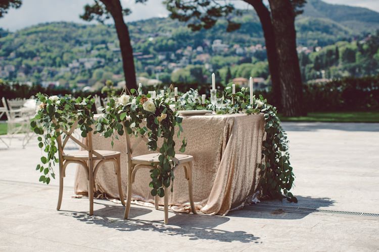 Table Setting Champagne Sequin Tablecloth Cream Blush Roses Greenery Decorated Chairs Flowers Candlesticks Vila Geno Venue Breathtaking Lake Como Wedding Ideas http://lillyred.it/