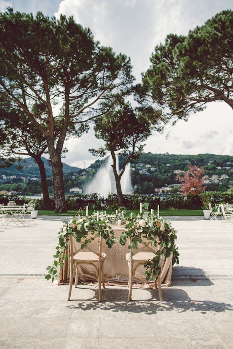 Table Setting Champagne Sequin Tablecloth Cream Blush Roses Greenery Flowers Decorated Chairs Candlesticks Water Fountain Trees Vila Geno Venue Breathtaking Lake Como Wedding Ideas http://lillyred.it/