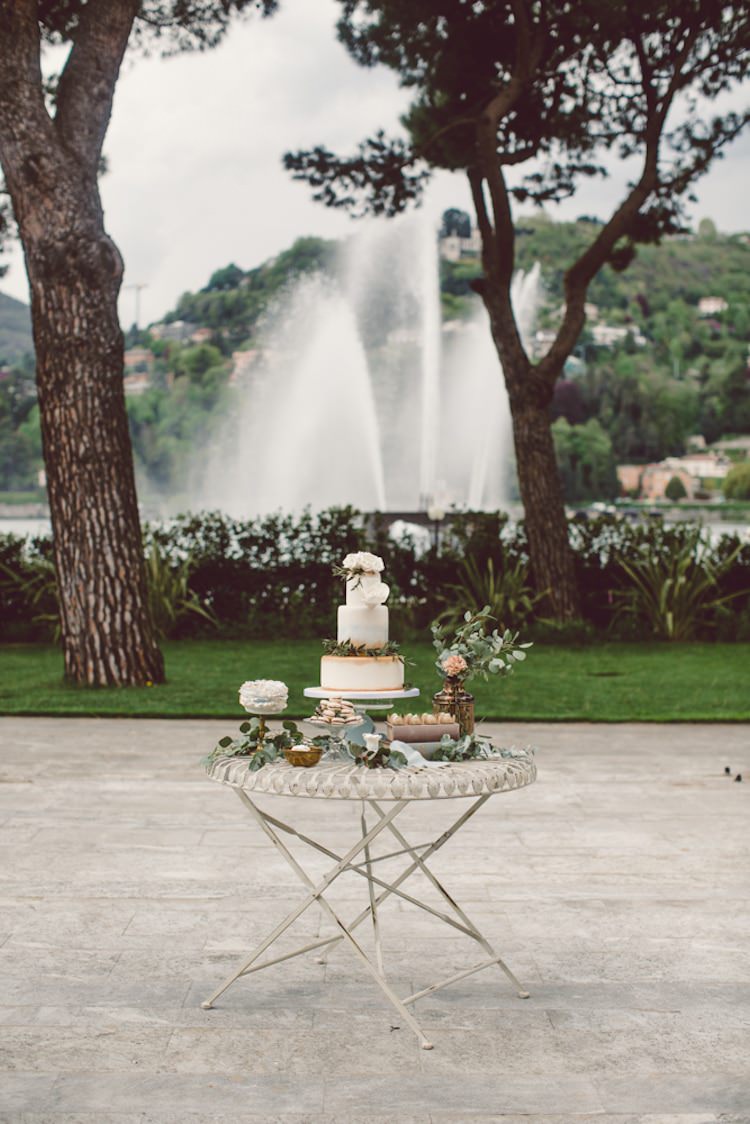 Dessert Table Gold Cream Blue Wedding Cake Roses Green Leaves Groom Cake Sweet Treats Cream Blush Roses Greenery Flowers Water Fountain Trees Breathtaking Lake Como Wedding Ideas http://lillyred.it/