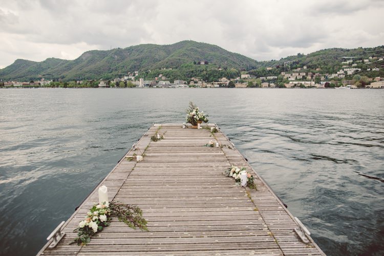 Outdoor Ceremony Idea Pier Lake Flowers Cream Blush Roses Greenery Candles Mountain View Breathtaking Lake Como Wedding Ideas http://lillyred.it/