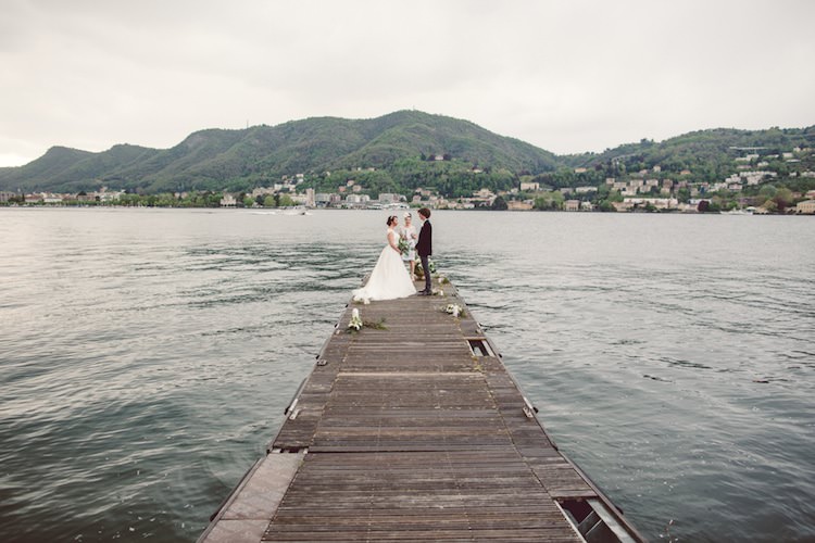 Outdoor Ceremony Idea Pier Lake Bride Groom Officiant Mountain Views Flowers Candles Breathtaking Lake Como Wedding Ideas http://lillyred.it/