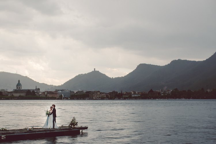 Outdoor Ceremony Idea Pier Lake Bride Groom Flowers Candles Mountain Views Breathtaking Lake Como Wedding Ideas http://lillyred.it/