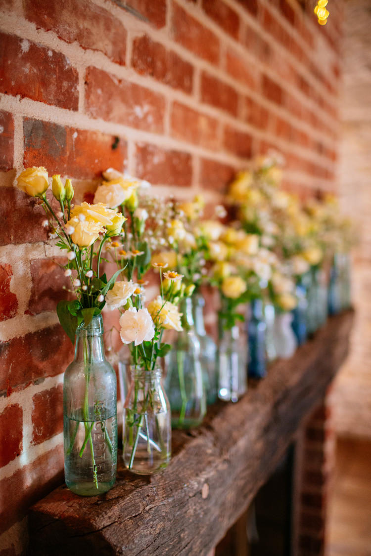 Bottles Flowers Mantle Piece Decor Peaches Mint Stylish Floral Wedding http://www.sarahleggephotography.co.uk/