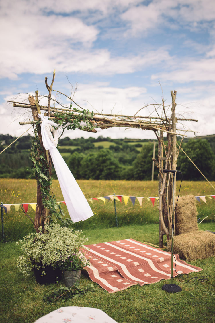 Arch Backdrop Ceremony Aisle Branch Tree Wood Outdoor Countryside Fair Wedding http://www.jennawoodward.com/