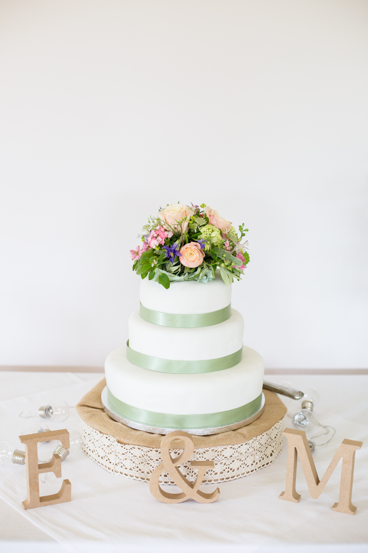 Cake Green Ribbon Flower Topper Table DIY Steam Railway Village Hall Wedding http://www.charlotterazzellphotography.com/