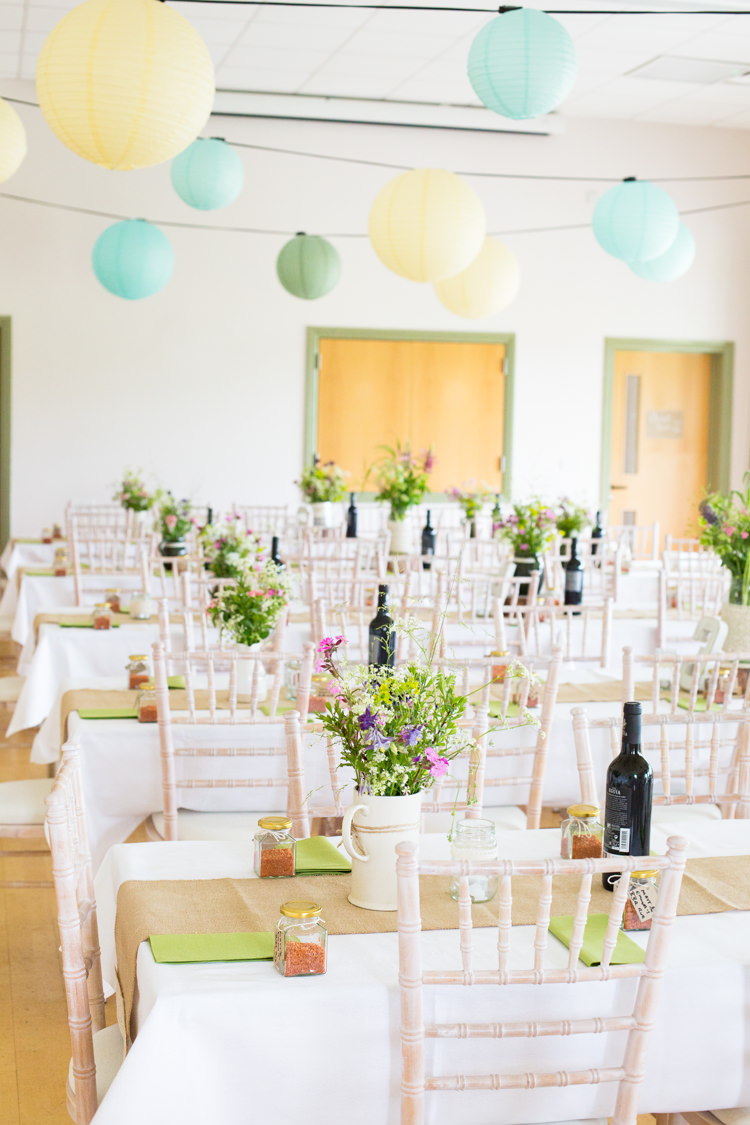 Lanterns Yellow Blue Green Pastel Flowers Long Tables Hessian Burlap DIY Steam Railway Village Hall Wedding http://www.charlotterazzellphotography.com/ 