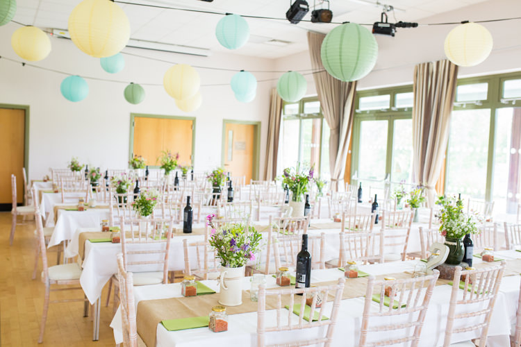 Lanterns Yellow Blue Green Pastel Flowers Long Tables Hessian Burlap DIY Steam Railway Village Hall Wedding http://www.charlotterazzellphotography.com/ 