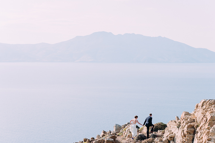 Bride Backless Bridal Gown Groom Rocks Ocean View Breathtaking Intimate Mykonos Destination Wedding http://www.annapumerphotography.com/