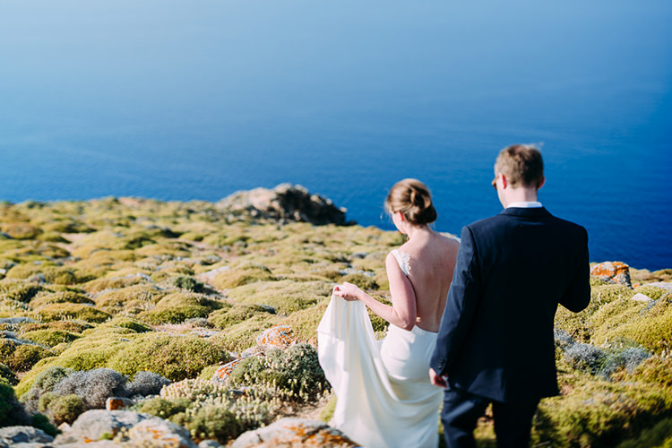 Bride Backless Bridal Gown Groom Green Grass Hill Ocean View Breathtaking Intimate Mykonos Destination Wedding http://www.annapumerphotography.com/