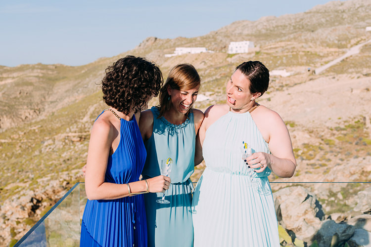 Wedding Guests Blue Outfits Cocktails Fun Breathtaking Intimate Mykonos Destination Wedding http://www.annapumerphotography.com/