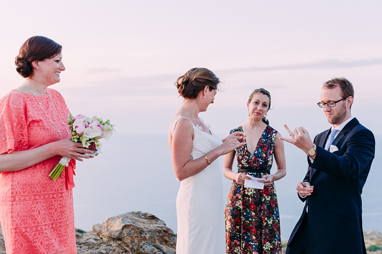 Outdoor Ceremony Bride Backless Bridal Gown Groom Navy Suit Blue Striped Tie Celebrant Breathtaking Intimate Mykonos Destination Wedding http://www.annapumerphotography.com/