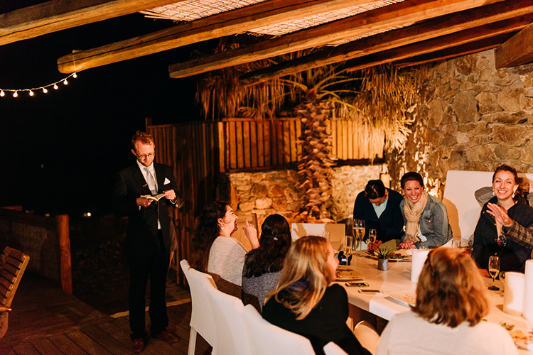 Reception Groom Navy Suit Blue Striped Tie Speeches Bride Denim Jacket Guests Fairy Lights Breathtaking Intimate Mykonos Destination Wedding http://www.annapumerphotography.com/