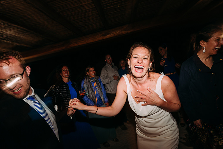 Reception Dancing Bride Backless Bridal Gown Groom Navy Suit Blue Striped Tie Guests Breathtaking Intimate Mykonos Destination Wedding http://www.annapumerphotography.com/