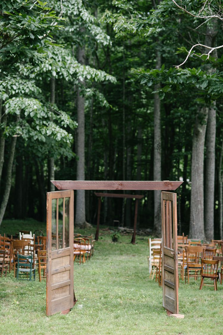 Outdoor Ceremony Set Up Wooden Door Frame Chairs Green Trees Grass Rustic Woodsy Wedding North Carolina http://abbyleighanne.com/