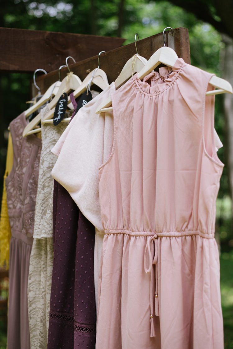 Bridesmaids Dresses Multicoloured Different Textures Wooden Hangers Door Frame Rustic Woodsy Wedding North Carolina http://abbyleighanne.com/