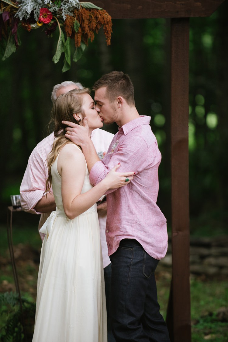 Outdoor Ceremony Bride Chiffon Bridal Gown Groom Pink Shirt Dark Jeans Wooden Doorframe Hanging Florals Rustic Woodsy Wedding North Carolina http://abbyleighanne.com/