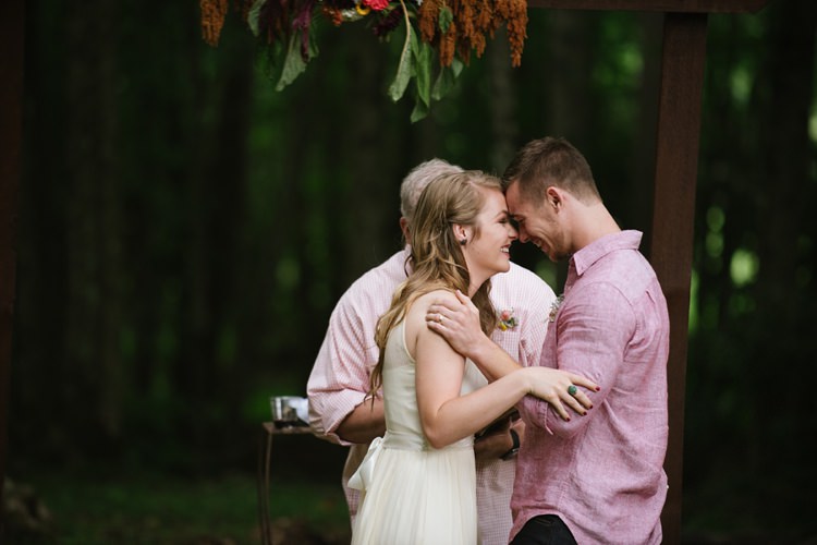 Outdoor Ceremony Bride Chiffon Bridal Gown Groom Pink Shirt Dark Jeans Wooden Doorframe Hanging Florals Rustic Woodsy Wedding North Carolina http://abbyleighanne.com/