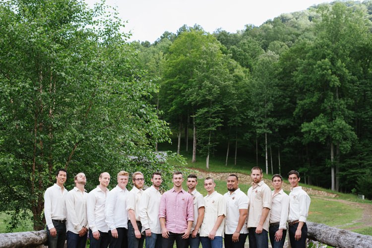 Groom Pink Shirt Dark Jeans Groomsmen White Cream Shirts Jeans Floral Buttonholes Wooden Bridge Green Trees Rustic Woodsy Wedding North Carolina http://abbyleighanne.com/