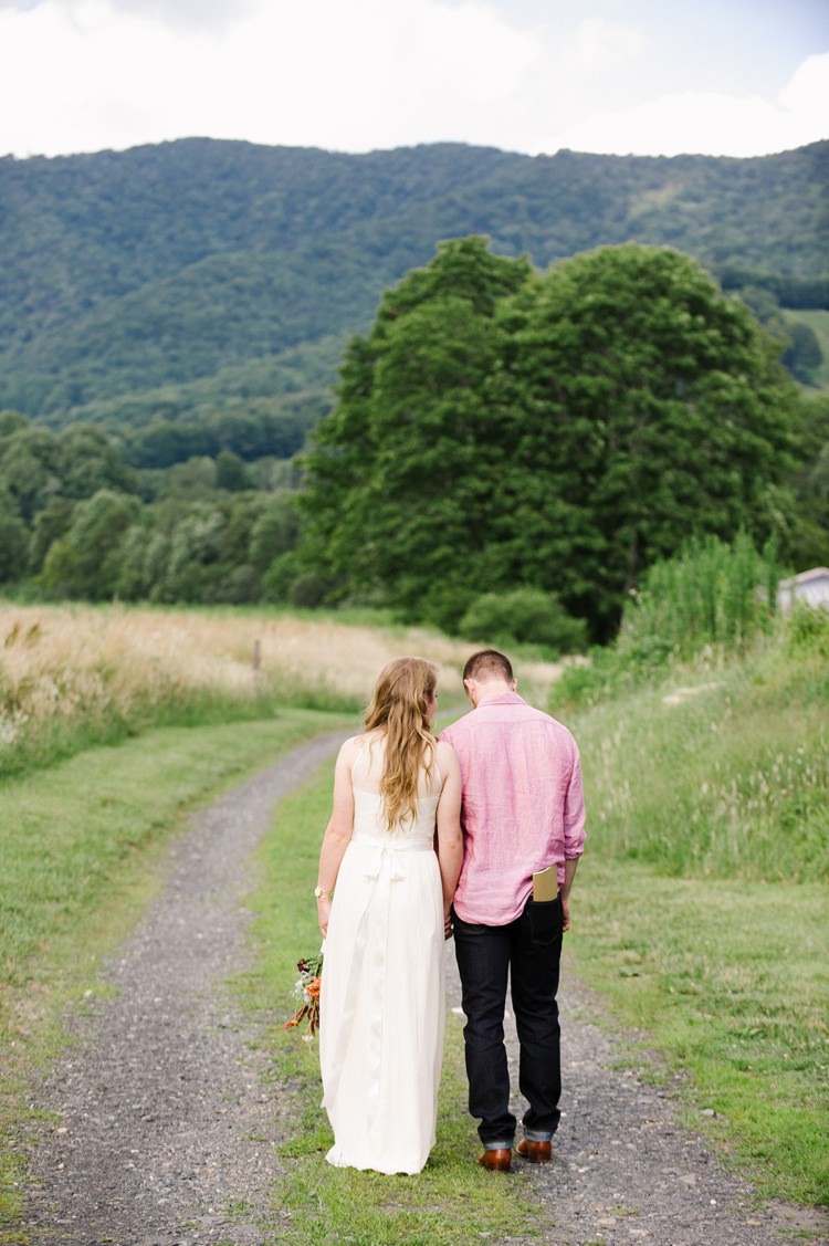 Bride Chiffon Bridal Gown Bouquet Loose Curls Groom Pink Shirt Dark Jeans Tan Shoes Country Road Trees Rustic Woodsy Wedding North Carolina http://abbyleighanne.com/