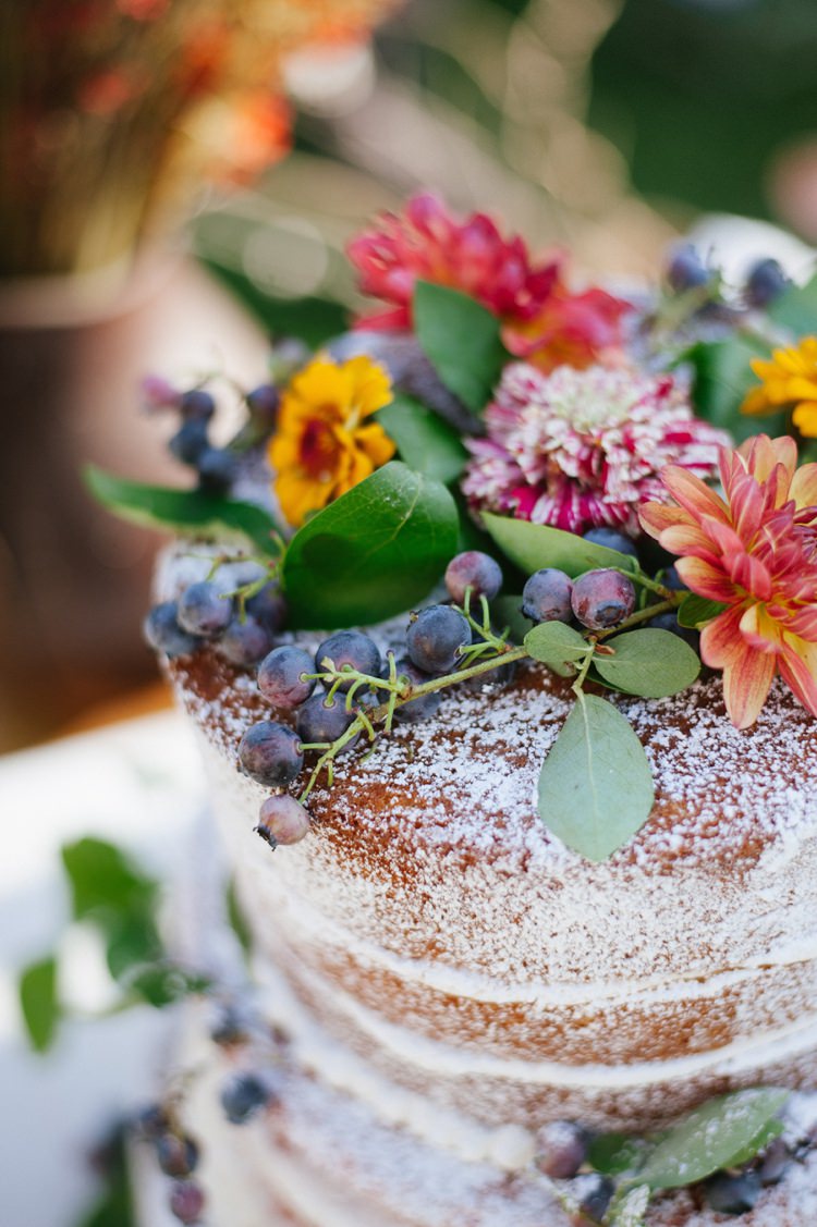 Naked Wedding Cake Topped With Multicoloured Florals Grapes Rustic Woodsy Wedding North Carolina http://abbyleighanne.com/