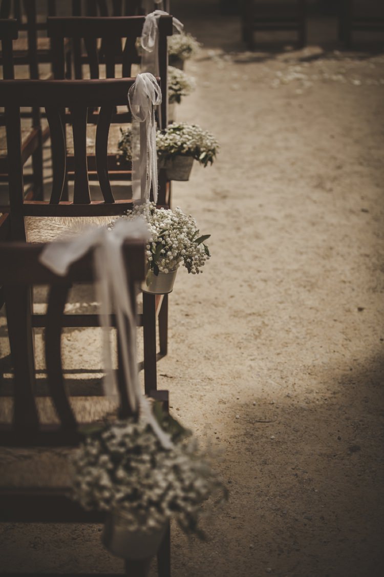 Ceremony Wooden Chairs Gypsophila Metal Buckets White Ribbons Atmospheric Abbey Tuscany Wedding http://www.angelicabraccini.com/