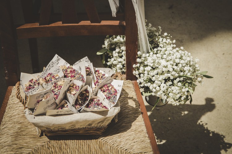 Outdoor Ceremony Flower Petals Sheet Music Wrappers Wooden Chairs Gypsophila Atmospheric Abbey Tuscany Wedding http://www.angelicabraccini.com/