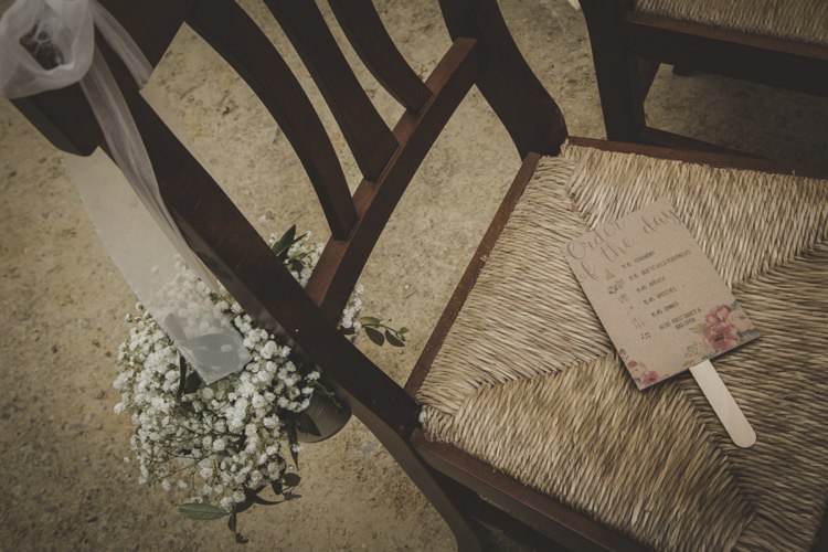 Order Of The Day Floral Sign Wooden Chair White Gypsophila Metal Bucket White Ribbon Atmospheric Abbey Tuscany Wedding http://www.angelicabraccini.com/