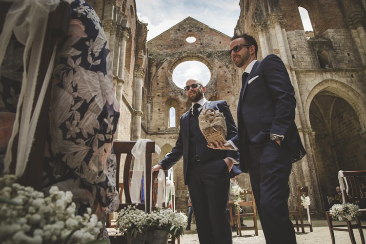 Outdoor Ceremony Historic Location Groomsmen Wooden Chairs Gypsophila Metal Buckets Ribbons Atmospheric Abbey Tuscany Wedding http://www.angelicabraccini.com/