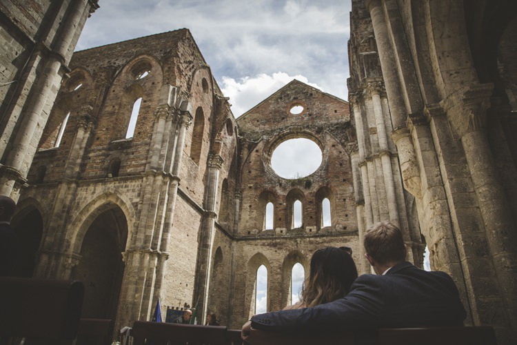Outdoor Ceremony Historic Location Cloudy Skies Guests Atmospheric Abbey Tuscany Wedding http://www.angelicabraccini.com/