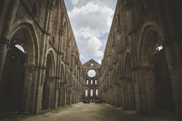 Outdoor Ceremony Historic Location Cloudy Skies Atmospheric Abbey Tuscany Wedding http://www.angelicabraccini.com/