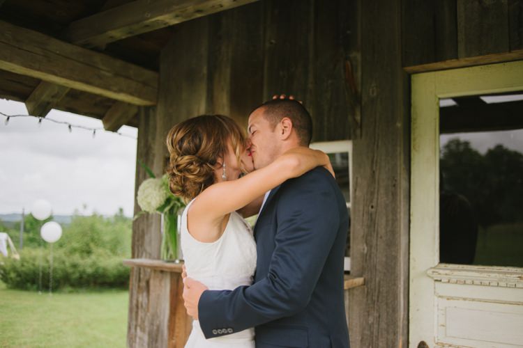 Bride Groom First Look Outside Kiss Rustic Wooden Hut White Hydrangeas Fairy Lights Trees Grass Romantic Fresh Outdoor Wedding Ontario http://www.rebeccabose.com/