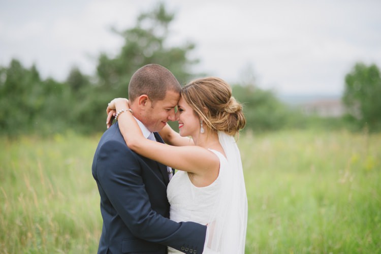 Bride Lace V Neck Bridal Gown Veil Earrings Red Lipstick Groom Navy Suit Light Blue Tie Trees Grass Romantic Fresh Outdoor Wedding Ontario http://www.rebeccabose.com/
