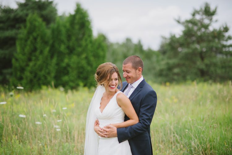 Bride Lace V Neck Bridal Gown Veil Earrings Red Lipstick Groom Navy Suit Light Blue Tie Trees Grass Romantic Fresh Outdoor Wedding Ontario http://www.rebeccabose.com/