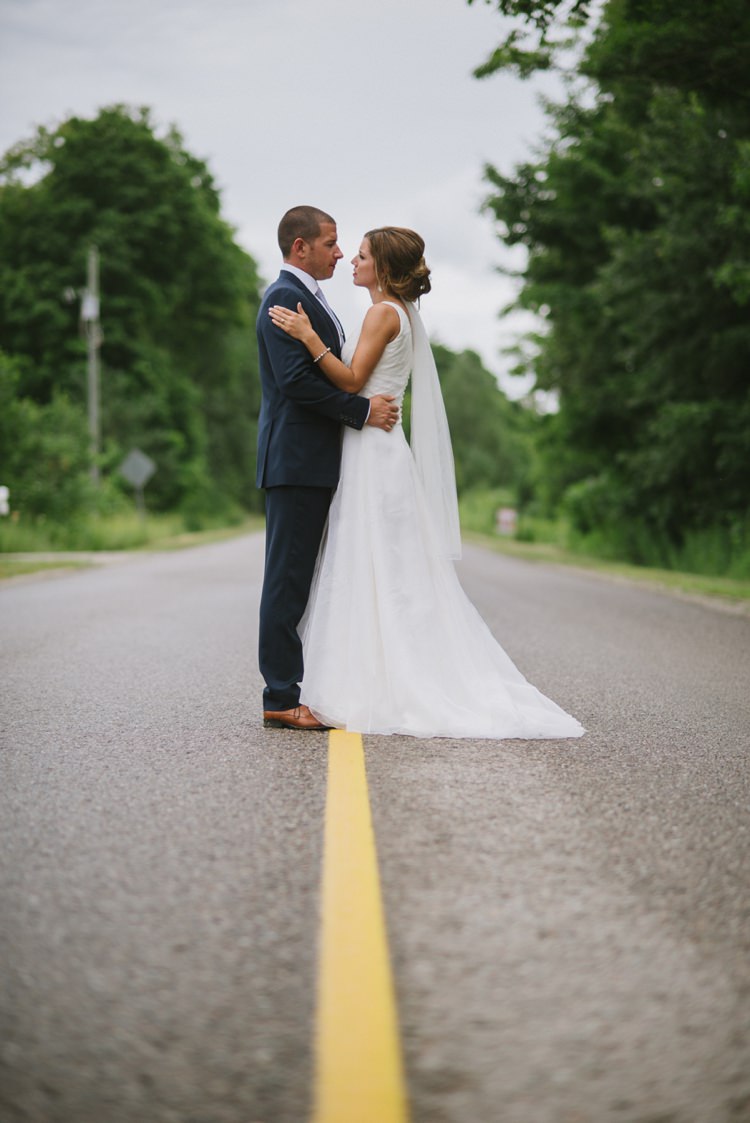 Bride Lace V Neck Bridal Gown Veil Groom Navy Suit Light Blue Tie Tan Shoes Trees Road Romantic Fresh Outdoor Wedding Ontario http://www.rebeccabose.com/