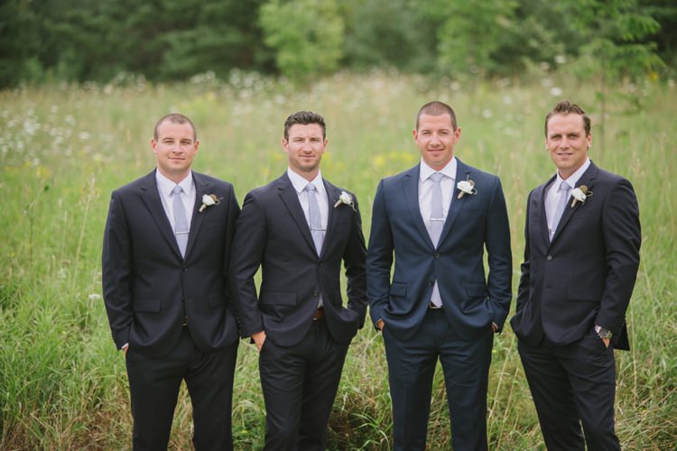 Groom Navy Suit Light Blue Tie White Floral Buttonhole Groomsmen Grass Yellow Flowers Romantic Fresh Outdoor Wedding Ontario http://www.rebeccabose.com/
