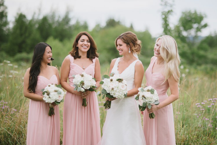 Bride Lace V Neck Bridal Gown Veil Earrings Bridesmaids Blush Dresses Bouquets White Light Pink Roses Hydrangeas Grass Trees Romantic Fresh Outdoor Wedding Ontario http://www.rebeccabose.com/