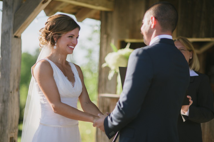 Outside Ceremony Rustic Wooden Hut Bride Lace V Neck Bridal Gown Veil Red Lipstick Drop Earrings Groom Navy Suit Romantic Fresh Outdoor Wedding Ontario http://www.rebeccabose.com/