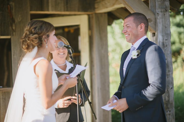 Outside Ceremony Rustic Wooden Hut Bride Lace V Neck Bridal Gown Veil Groom Navy Suit Light Blue Tie White Floral Buttonhole Celebrant Romantic Fresh Outdoor Wedding Ontario http://www.rebeccabose.com/