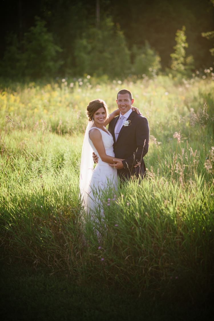 Bride Lace V Neck Lace Bridal Gown Veil Groom Navy Suit Light Blue Tie White Floral Buttonhole Green Grass Trees Romantic Fresh Outdoor Wedding Ontario http://www.rebeccabose.com/