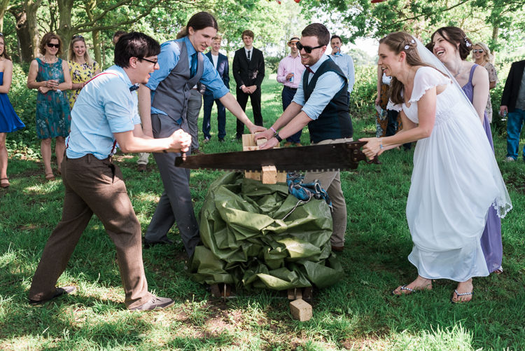 Log Cutting Bride Groom Outdoor DIY Farm Wedding http://www.markewelsphotography.com/