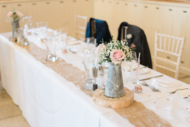 Hessian Metal Jug Flowers Log Decor Fresh Pink Barn Wedding http://www.charlotteleysphotography.co.uk/