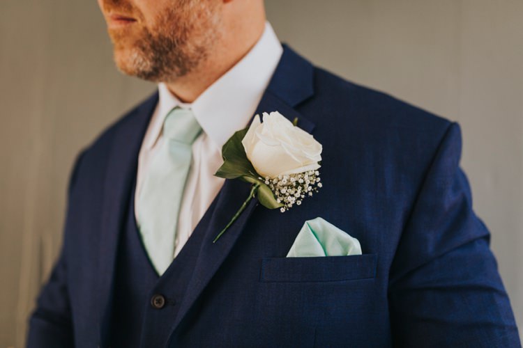White Rose Buttonhole Mint Tie Groom Creative Festival Wedding http://benjaminstuart.co.uk/