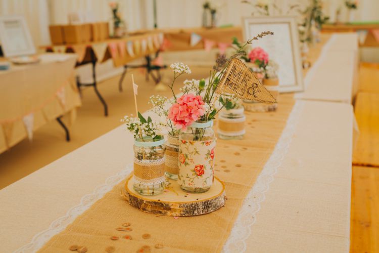 Table Centrepiece Decor Log Slice Floral Flowers Jars Flag Sign Hessian Lace Burlap Creative Festival Wedding http://benjaminstuart.co.uk/