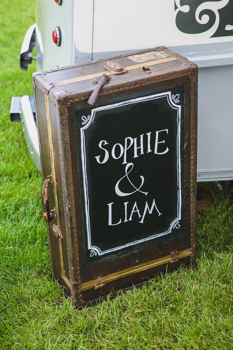 Suitcase Black Board Sign Outdoorsy Colourful Tipi Wedding http://www.tierneyphotography.co.uk/
