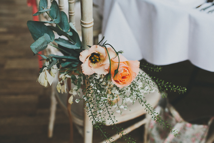 Chair Flowers Roses Foliage Rustic Coral Barn Wedding http://jasonwilliamsphotography.com/