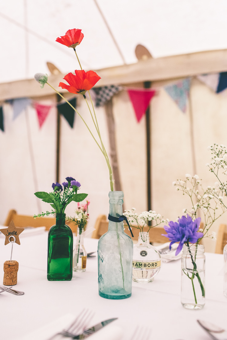 Poppies Bottle Flowers Centrepiece Decor Home Made Glastonbury Festival Wedding http://www.emmaboileau.co.uk/