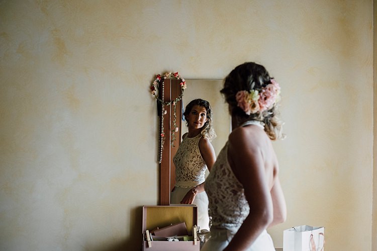Bride Lace Halter-Neck Top Gold Crystal Buttons Tulle Skirt Fresh Pink White Flowers Soft Hairstyle Mirror Outdoor Floral Countryside Wedding Veneto http://serenagenovese.com/