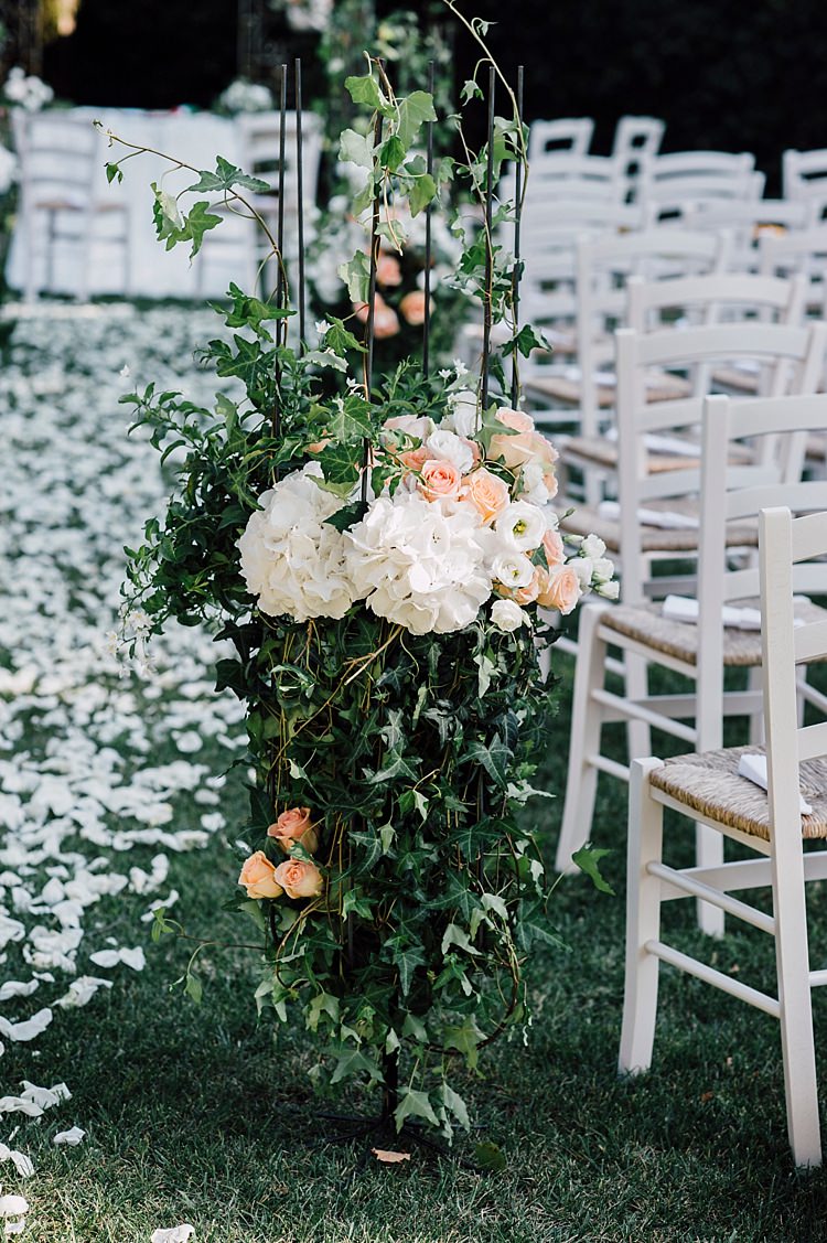 Ceremony White Peach Flowers Roses Hydrangea Greenery Petals White Chairs Outdoor Floral Countryside Wedding Veneto http://serenagenovese.com/