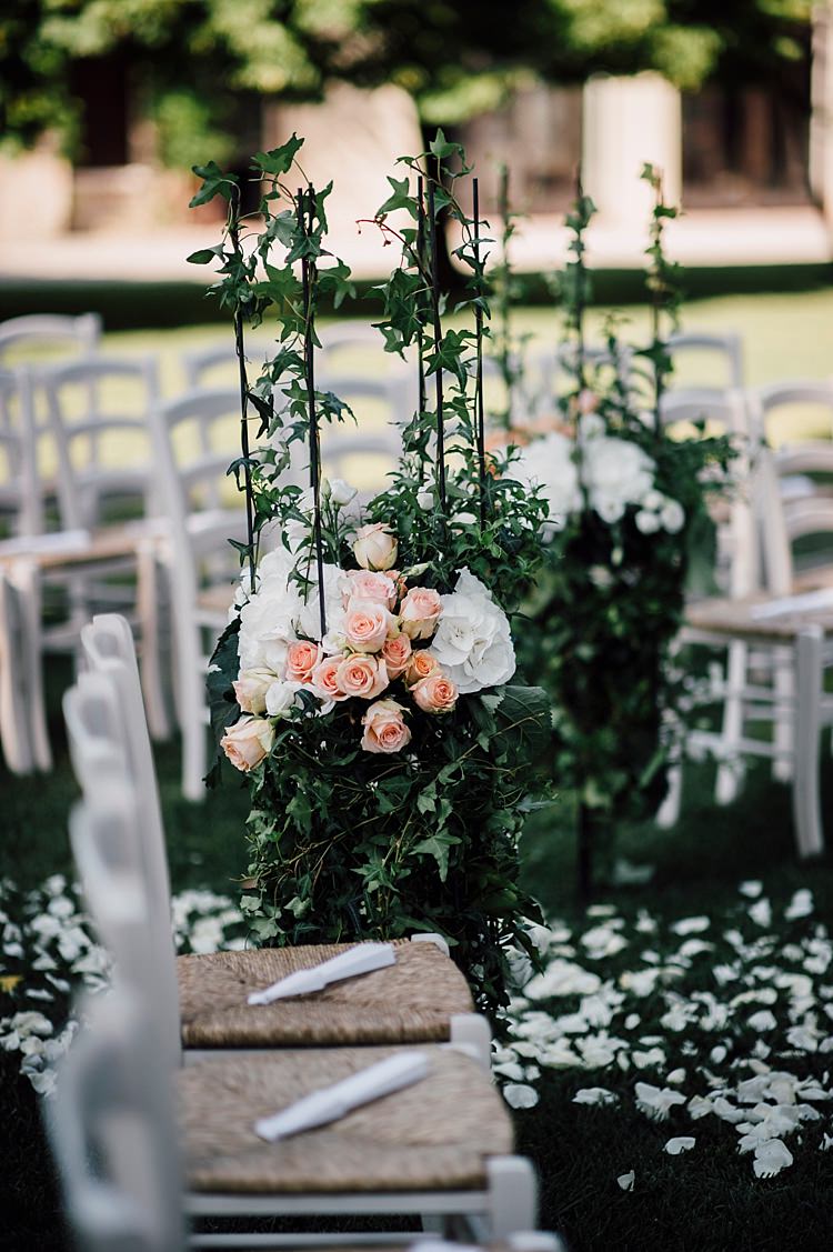 Ceremony White Peach Florals Roses Hydrangea Greenery Petals White Chairs Aisle Outdoor Floral Countryside Wedding Veneto http://serenagenovese.com/